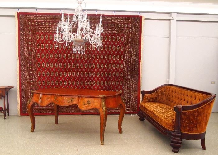 Rug, mahogany empire sofa, chandelier, French desk