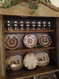 This primitive cabinet provides display and storage space and beautifully houses the English transferware and silver goblets. 