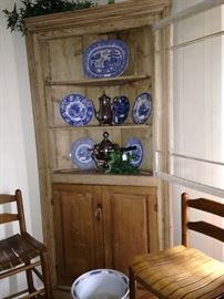 Exceptional primitive corner cabinet; blue & white selections; two of three wooden stools