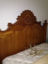 Queen bed; antlers