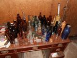 Antique bottles, many applied lip, pontil marks, embossed medicinal and other labels, cobalt, brown, stoneware