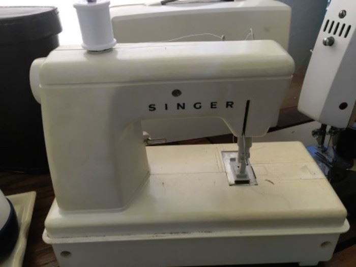 Singer travel sewing machine with case.