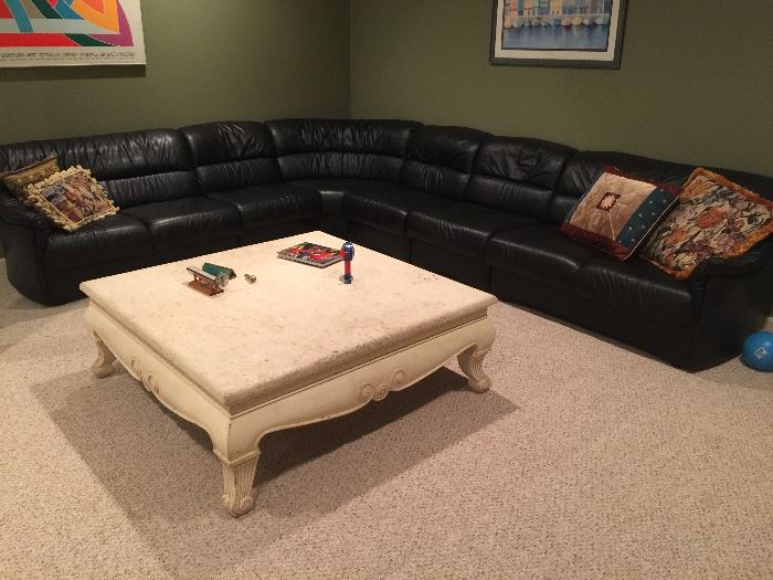 98. Black Leather Sectional: 2 Loveseats, 1 Corner, 3 Armless Sections (9'6", 11' x 34" x 31")                                    99. Travertine Top w/ Painted Base Coffee Table (48" x 48" x 17")