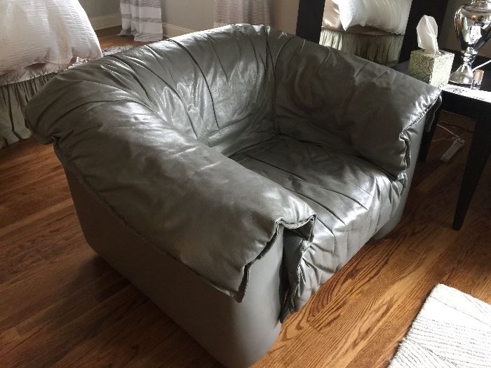 57. Grey Leather Blanket Cover Chair (44" x 38" x 29")