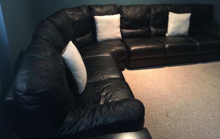 86. Black Leather Sectional (117" x 90" x 33" deep x 35" h)