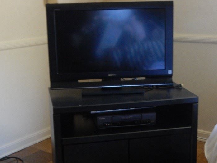 Flat screen tv and shelf.