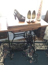 Old treadle machine with 1940s lady’s shoes