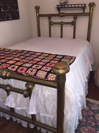 One of two old double brass beds for sale 
