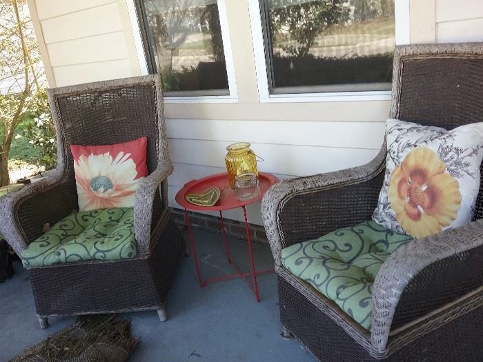 outdoor wicker chairs, red metal side table, outdoor pillows