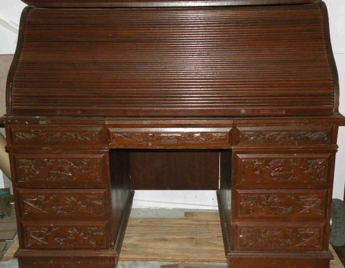 Heavily carved roll top desk