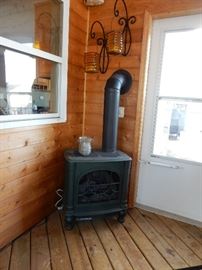 Bench, Rain Barrel and in the 3 season room you go to more treasures. Stay Warm with this Beauty