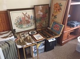 assorted handcrafted needlepoint pictures