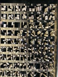 Some of the more than 1,000 metal alpha/numeric dies for the Monarch Jr printing machine