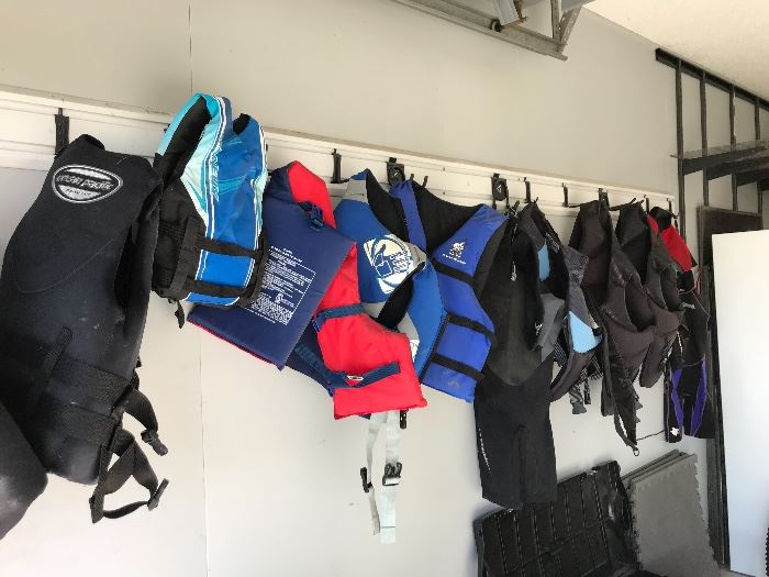 Ocean pacific and various other brands of life vests and body suits. Adult and kids.