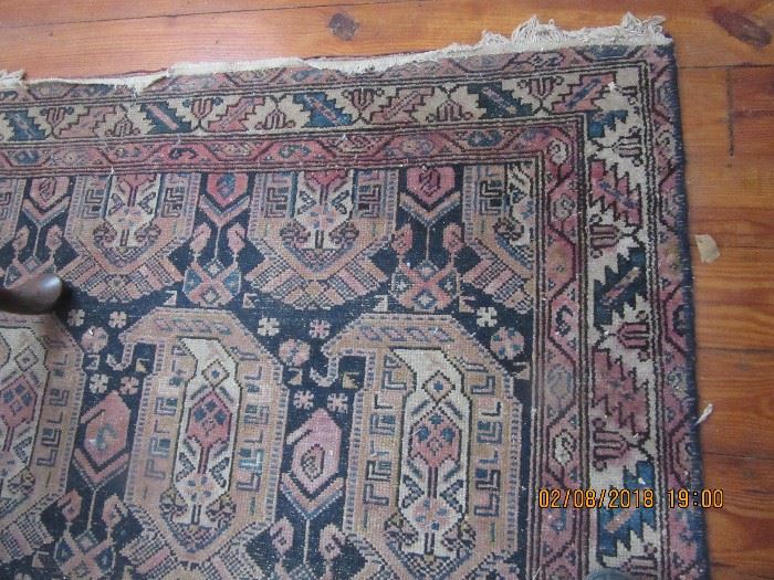 One of several oriental rugs. 