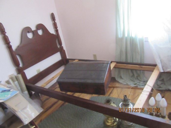 Carved posts twin bed. The pine schoolmasters desk is also pictured.