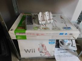 Wii with upgraded drive, extra charger, wii draw and 100's of games.