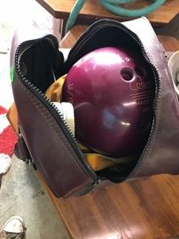a bowling ball with ladies shoes 