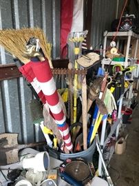 a can full of landscape tools, flags, etc