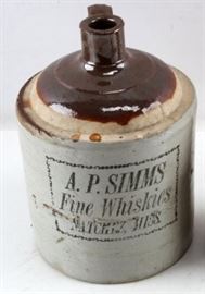 An Antique 1 gallon A.P. Sims Stoneware Whisky Jug | A two-toned Jug Marked "A.P. Simms Fine Whiskies, Nachez, Miss" | Stamped logos are clear and bold. 
Date: 19th Century 