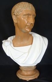  Exceptional Large Italian Bust of Caesar | Hand made in Italy of Terracotta | The upper section of the bust is fashioned of red clay, below of which is Caesar’s Robe in a white glazed classical attire | The bust of Caesar depicts the Roman Emperor at a younger age. It bears a very close resemblance to the head of the Bronze Sculpture of Julius Caesar in Rimini, Italy | The sculpture is raised on a matching and incorporated base | The bust measures 24″ (60.96cm) in height, and 17″ (43.18cm) width. Gaius Julius Caesar[b] (Classical Latin: [ˈɡaː.i.ʊs ˈjuː.li.ʊs ˈkae̯.sar]; 13 July 100 BC – 15 March 44 BC), known as Julius Caesar, was a Roman politician, general, and notable author of Latin prose. He played a critical role in the events that led to the demise of the Roman Republic and the rise of the Roman Empire. In 60 BC, Caesar, Crassus, and Pompey formed a political alliance that dominated Roman politics for several years. Their attempts to amass power as Populares were opposed by the