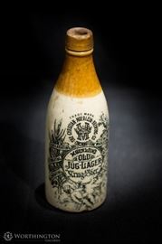 8.75″ x 3″ | The Christian Moerlein Brewing Co. | Bottle | Old Jug-Lager | Antique This is an antique Old Jug-Lager bottle manufactured by The Christian Moerlein Brewing Co. Made out of ceramic, this bottle is painted with a brown shade of desert sand on the neck, and on the base, a creme color with decorative black detailing. 