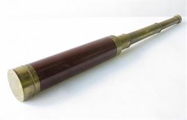 Antique Brass telescope with wood outer marked with name of previous owner. Slides to triple in size. Lens cap included. 9.5 inches height, 2 inches width, 2 inches depth. 9.5"H, 2"W, 2"D Good. 