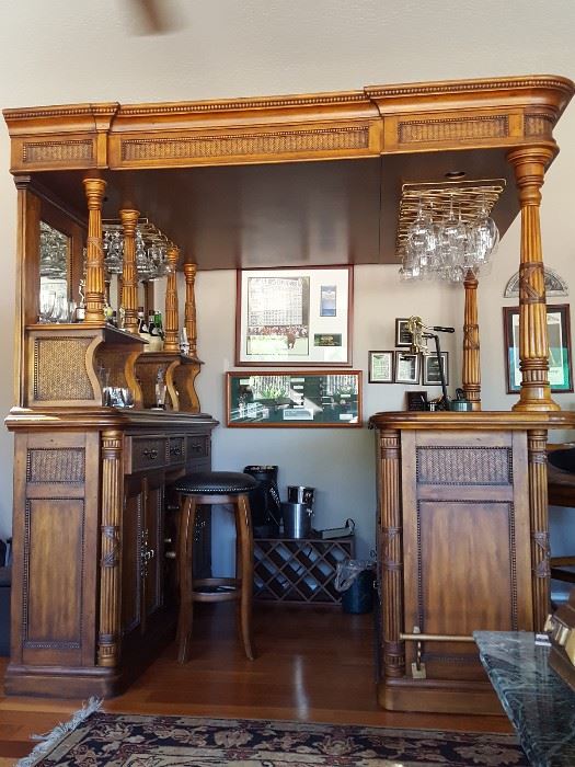 Fine Furniture Bar. Hardwoods/Cherry Solids and Veneers;Rattan;Leather. The top unit with posts provides canister lighting and overhead stemware storage, supported by heavily carved posts.