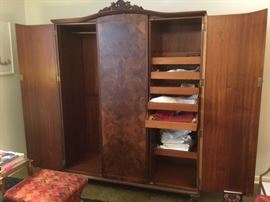 Armoire open - middle door opens too - has shelves or can use either way