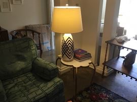 Mid-Century end table and lamp table is unusual shape with brass colored legs