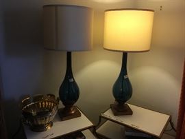 Two retro mid-century matching lamps on top of 2 matching sidetables