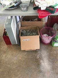 Box fan, box full of tea light candle holders, pink wire baskets