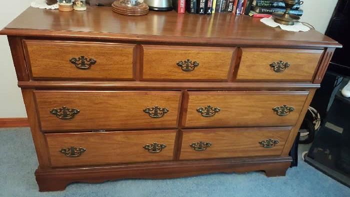 Beautiful dresser in great condition. Can be painted and used as an entertainment center or changing table.