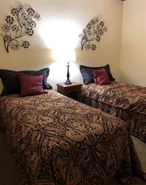 Twin Beds w Custom Bedding, Metal Wall Art, Side Table, Table Lamp