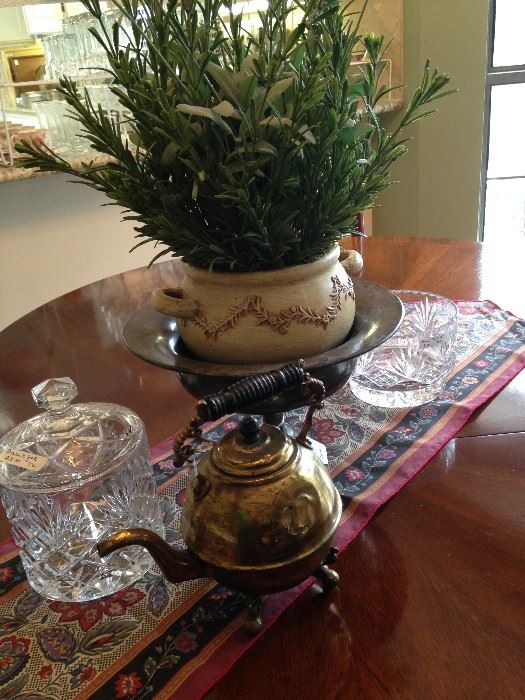 Biscuit barrel; brass tea pot; artificial arrangement