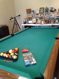Pool table; telescope; picture frames