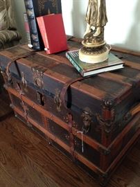 Such a good looking trunk can  serve for storage  AND a great coffee table.