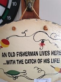 "An old fisherman lives here . . . with the catch of his life!"