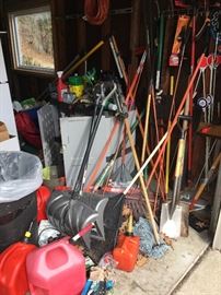 OLots of gargening tools, gas cans, shovels, rakes, etc