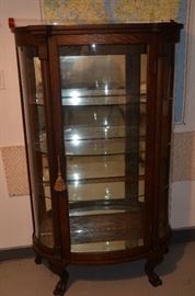 Antique bow-front display case - mirrored back and bottom, illuminated from top