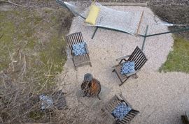 Four teak chairs, sold as a set