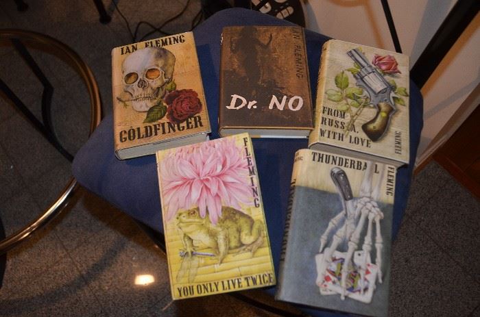 Five early Ian Fleming books with paper covers in near pristine condition.