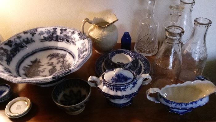 Blue and white china, milk bottles, decanters