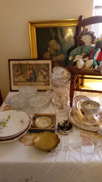 Religious themed artwork, antique dishes, antique child's chair