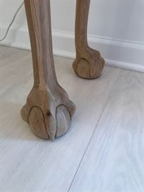 Carved "Ball and Claw" feet on the entry table.