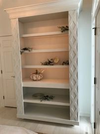 Lighted open shelf cabinet with built in outlets
