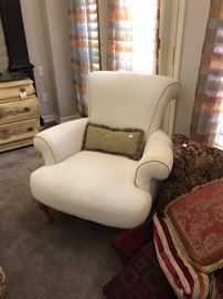 White upholstered chair and wonderful pillow selection