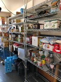 Shelves of Food supplies, Water jugs, Mr Heater Big Buddy's, Microwave oven, Delongi Toaster oven