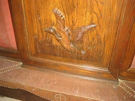 Detail of unique oak carved bar & mirrored back bar with stainless counter