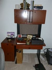 Part of the computer desk and wood file cabinet